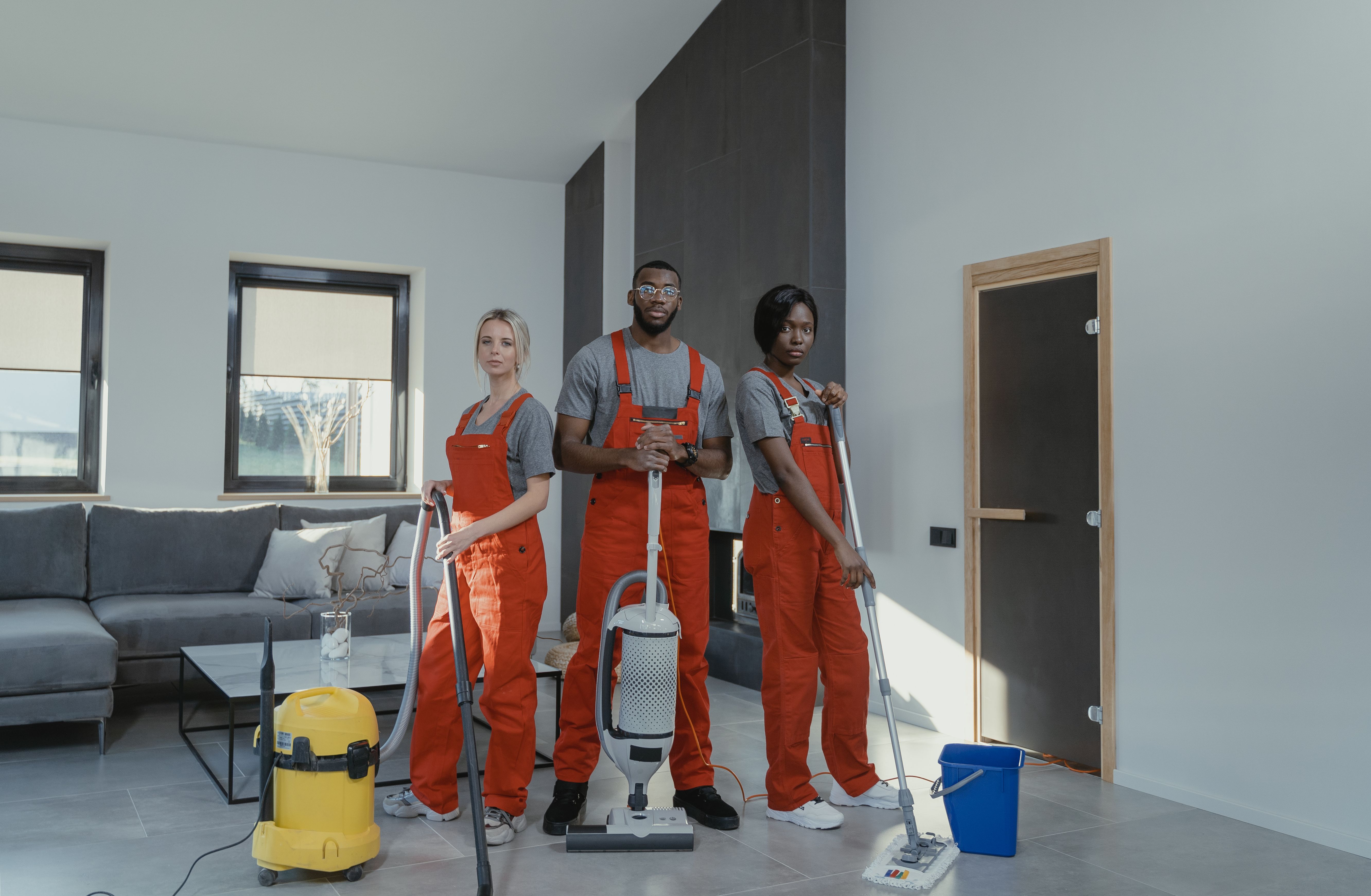 Professional cleaning team with cleaning equipment